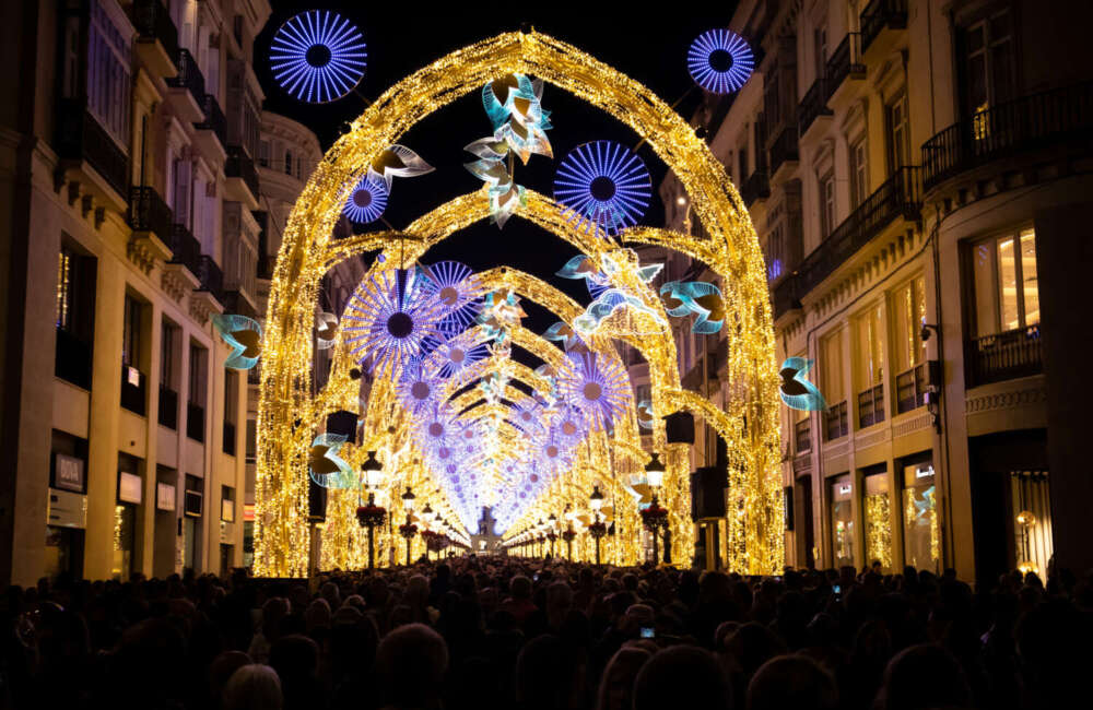 Thousands of people enjoying the Christmas light spectacle called "The Christmas Forest", on Marquez de Larios, in the centre of Malaga, Spain.