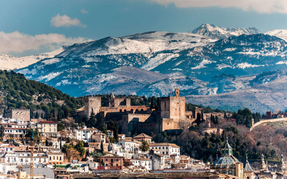 Winter view of the famous Alhambra in front of Sierra Nevada, Spain.