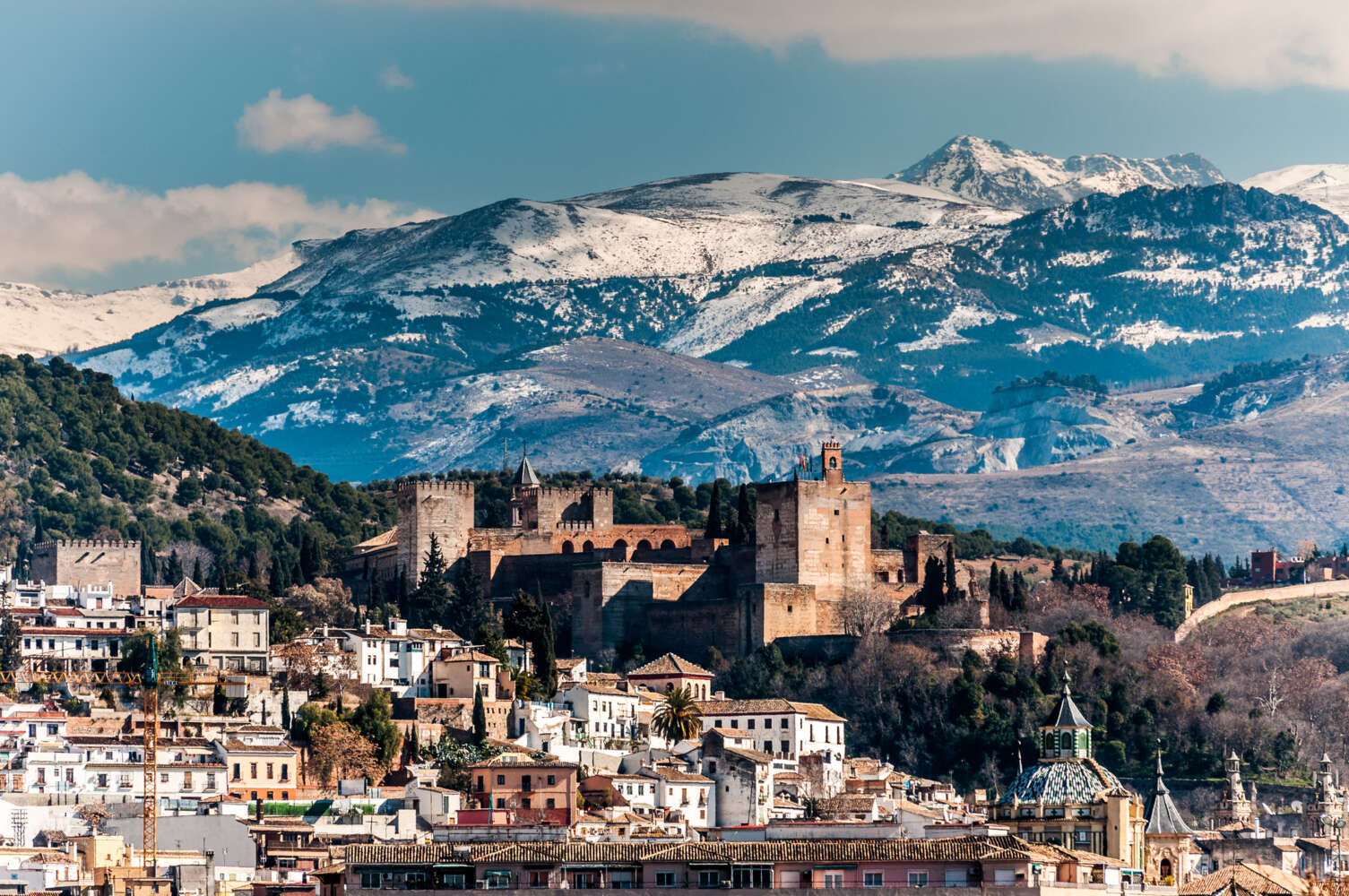 Winter view of the famous Alhambra in front of Sierra Nevada, Spain.
