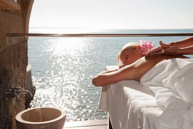 Woman,Having,Massage,By,The,Ocean Woman,Having,Massage,By,The,Ocean