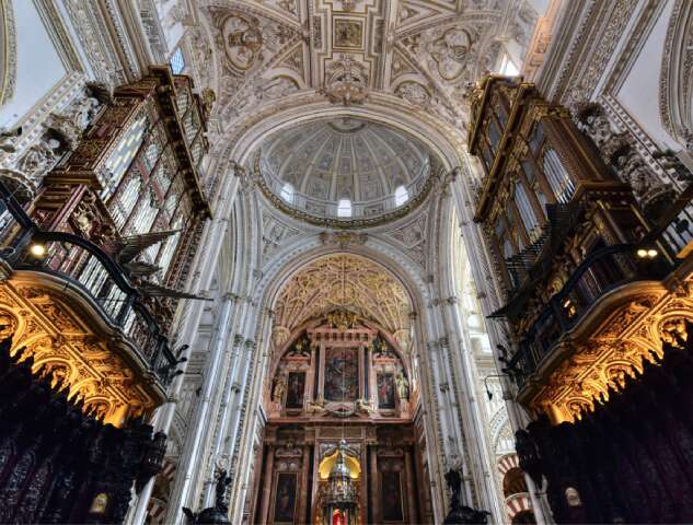 vaultedss Vaulted ceiling richly decorated with stucco and gold inside the Mezquita-Catedral de Córdoba, also known as the Cathedral of the Conception of Our Lady, in Córdoba, Spain.